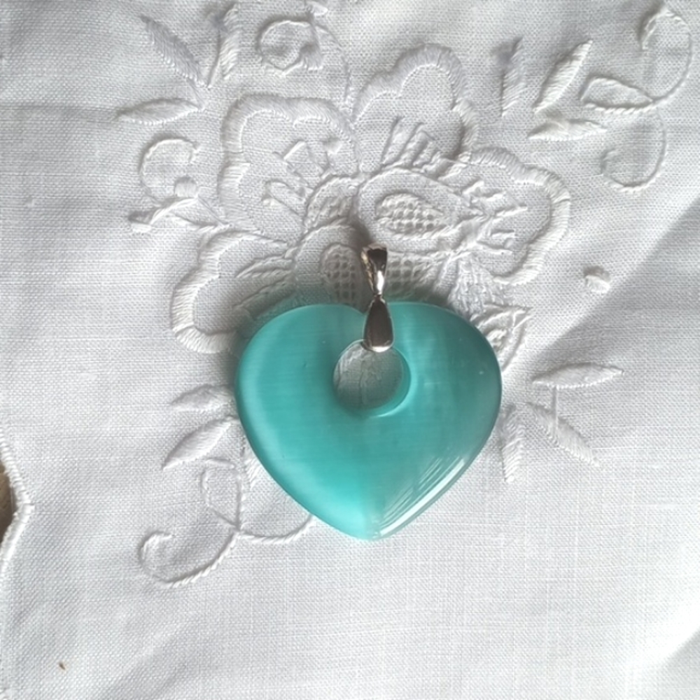 Teal blue tiger cat eye heart-shaped stone pendant with silver